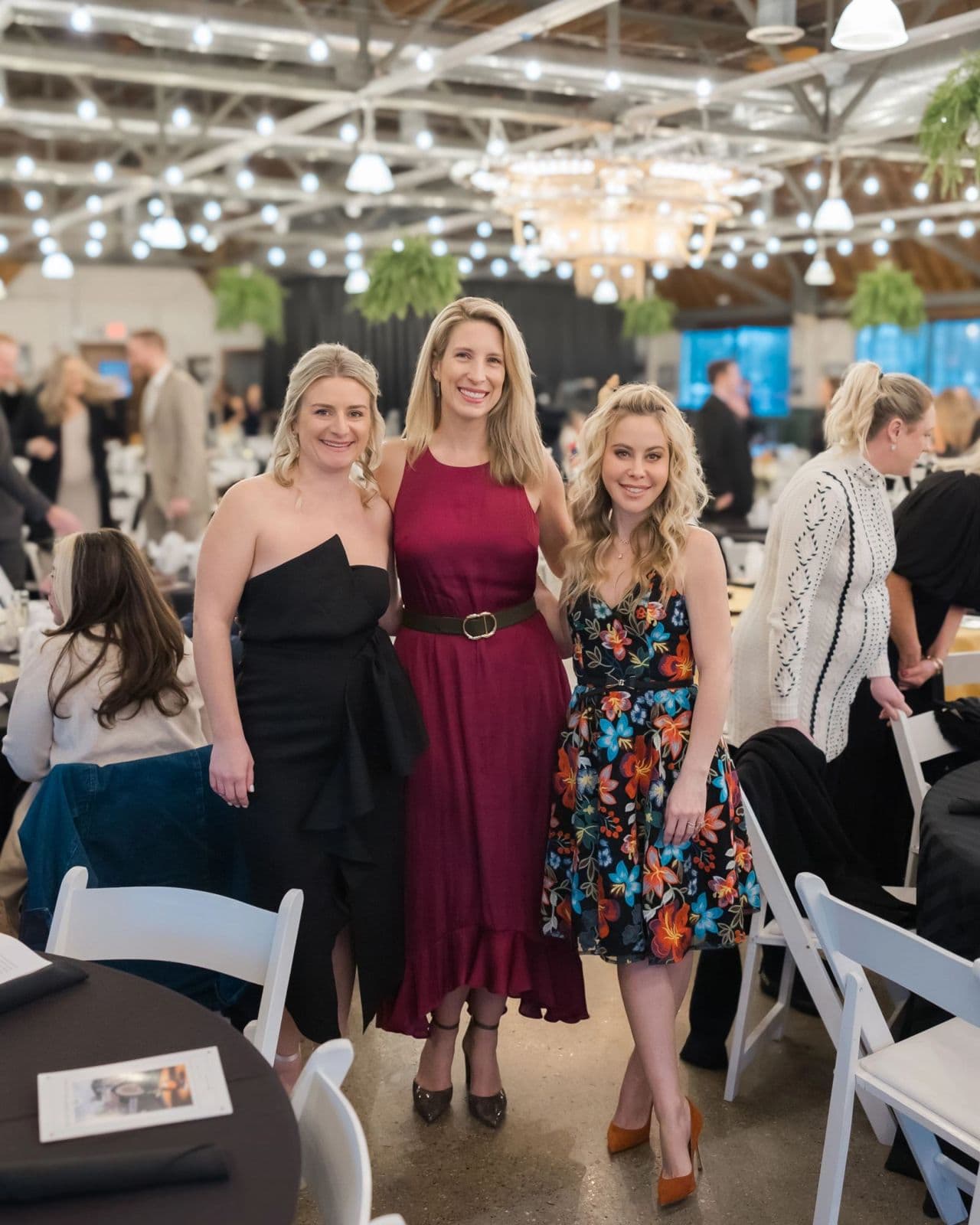 Three guests at a Brilora gala dinner